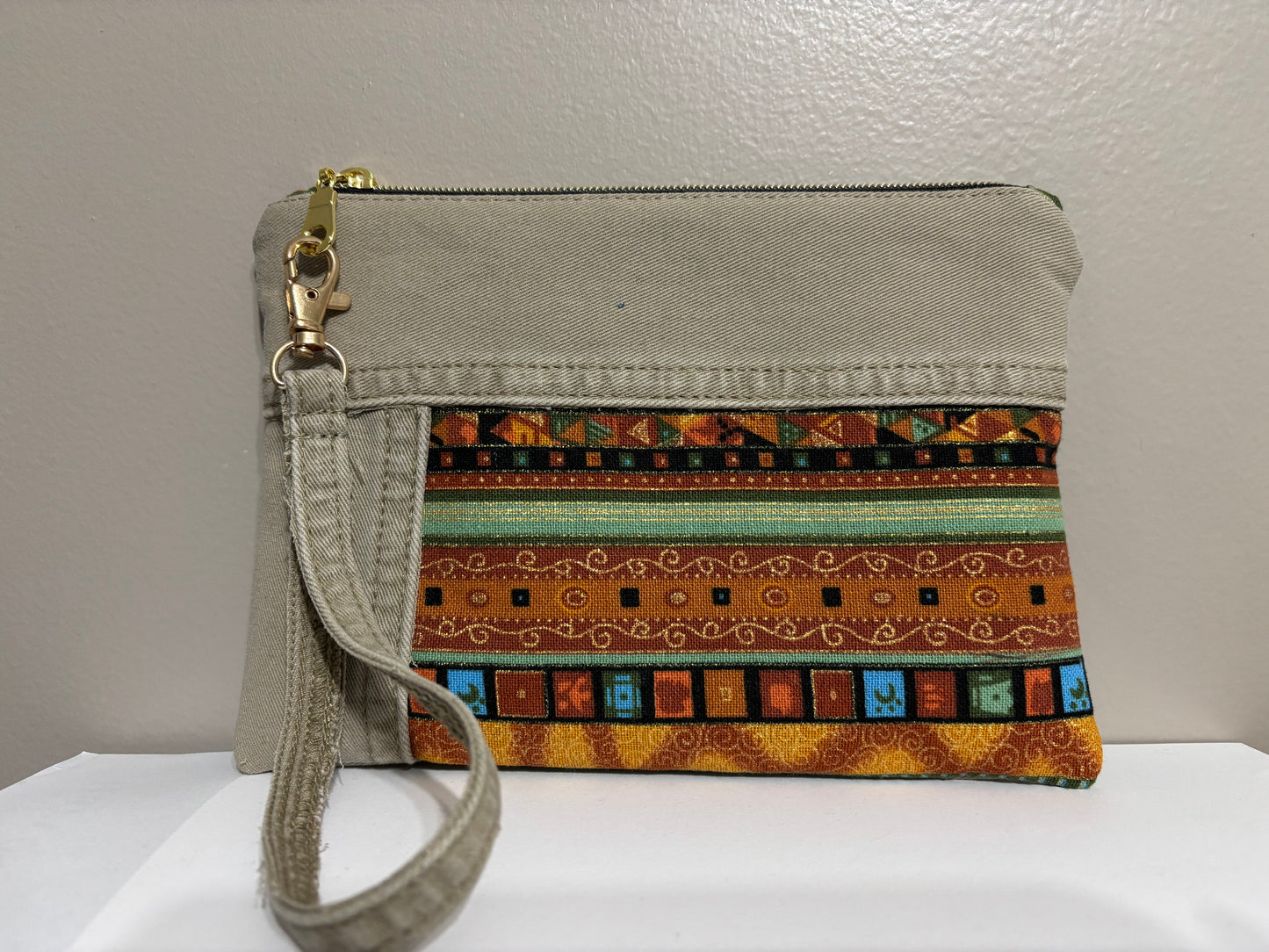 Wristlet from Upcycled Khaki Denim Jean Parts and Colorful Orange and Gold Fabric