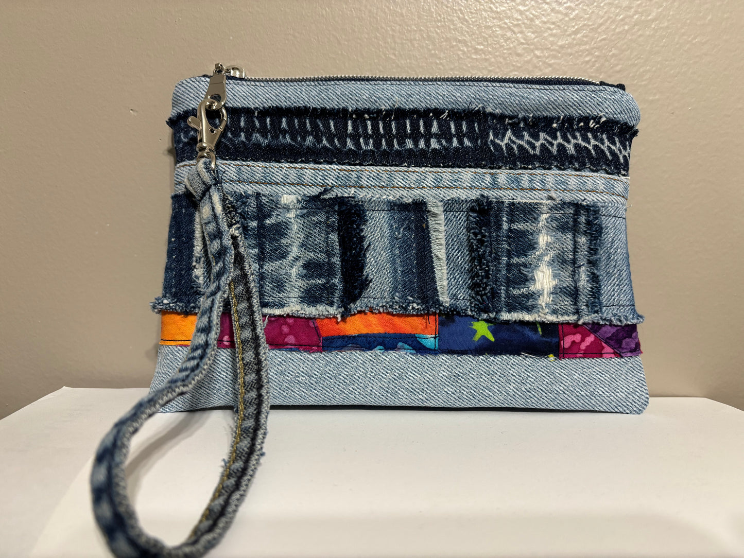 Wristlet from Upcycled Denim Parts and Colorful Patchwork Accent